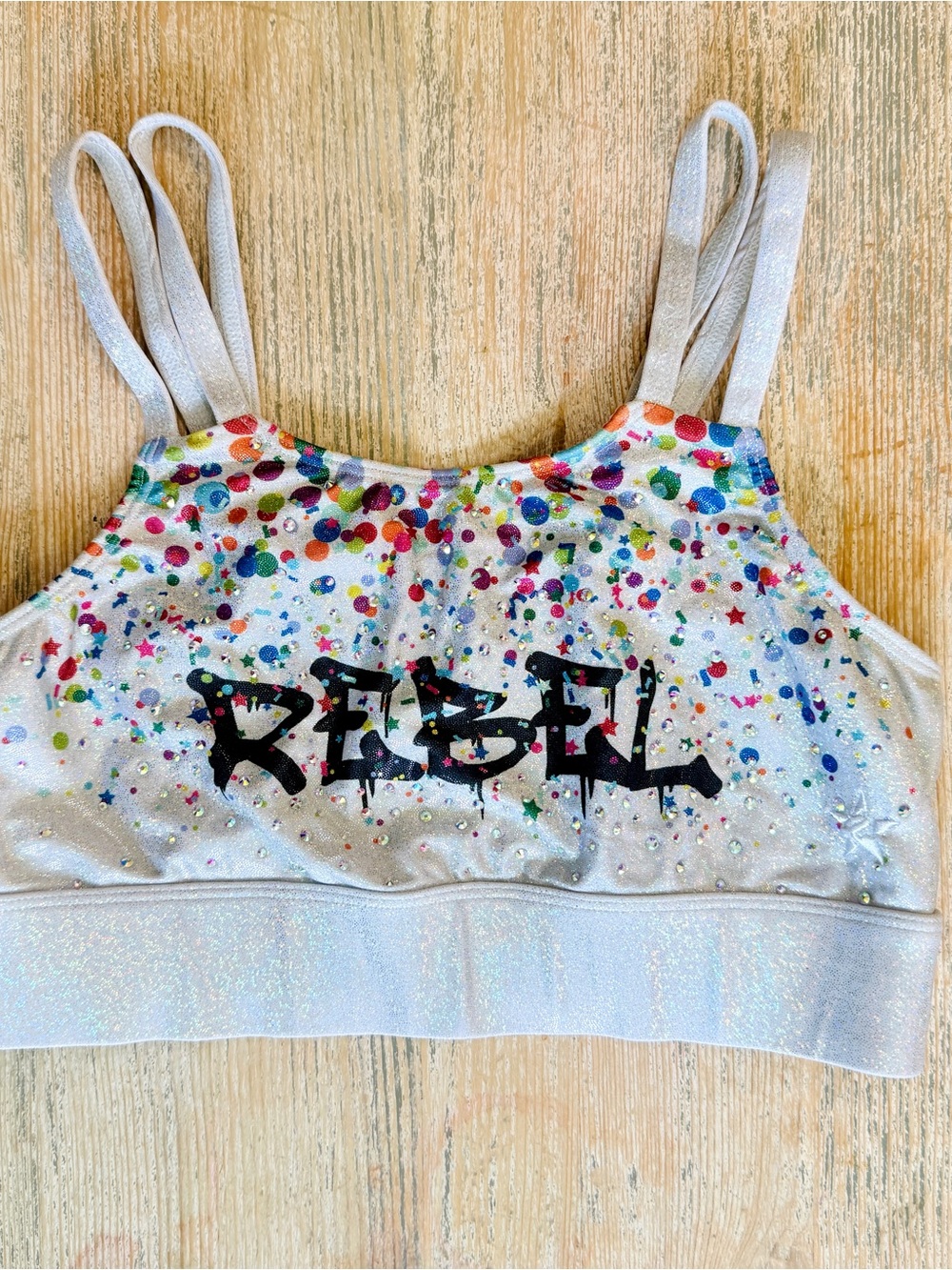 Rebel Athletic Women’s Sparkle Confetti Sports Bra with 'REBEL' Graphic - Silver